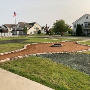 Crushed granite gathering space with fire pit installed at The Villas Condominiums in Mount Pleasant.