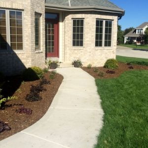 New mulch beds and plantings create a welcoming entrance to this home in Mount Pleasant.