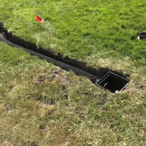 Surface water catch basin installed to increase intake of water into drain tile.
