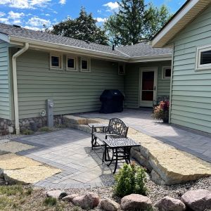 Two tiered patio and walkway installed at rear entrance of home in Caledonia using County Materials Grand Vantage pavers