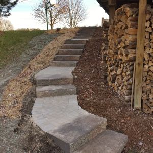 Unilock precast steps installed to provide staircase from driveway to walkout basement in Caledonia.