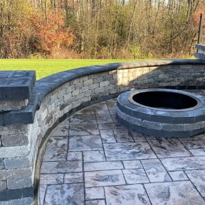 County Materials Summit Stone seat wall and pillars installed in Caledonia. Tumbled finish blocks used in Timeless color with Reflection color accents.