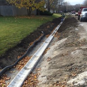 Concrete ditch blocks are installed to promote drainage. **Block sold by Bark River Concrete Products**