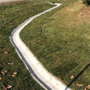 Ditch block installed to prevent weeds and other obstructions that will block the water flow. Project installed in Mount Pleasant, WI. **Block sold by Bark River Concrete products**