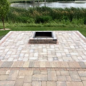We can do square fire pits as well as round. The steel liner is surrounded with Unilock Brussels block to match the new paver patio. Paver patio and fire pit project by Dresen Landscape Contractors LLC, Racine, WI,