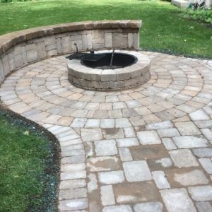 Rockwood fire pit with a steel liner and cooking grate. Paver patio, walk and fire pit project by Dresen Landscape Contractors LLC, Racine, WI