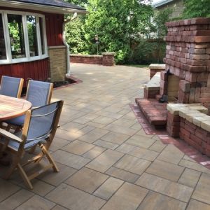 County Materials Elements paver patio with seat walls and fireplace in Caledonia.