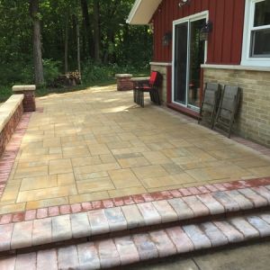 County Elements paver patio with seat walls and steps in Caledonia.