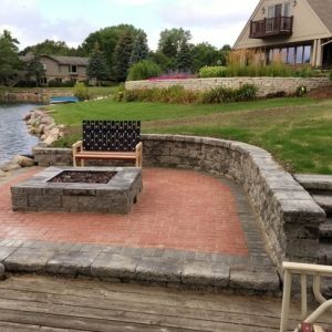 Lake side patio with fire pit made of County Materials products in Mount Pleasant.