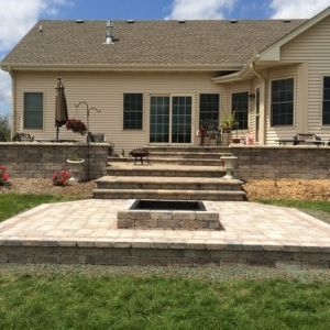Unilock Brussels block patio and walls in Mount Pleasant. Unigranite paver accent added for extra interest..