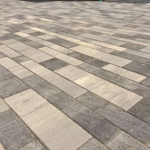 Blend of Unilock Artline smooth finish pavers (Steel Mountain) and Artline Il Campo finish pavers (Granite Blend)