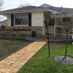 After image: Old concrete walkways are replaced with pavers.