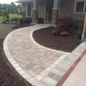 Unilock Brussels paver front walkway (Sierra color with Sandstone border) in Caledonia.