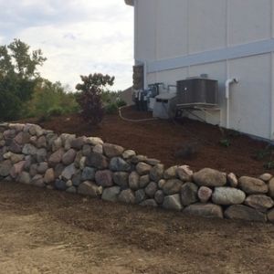 Boulders provide a natural material solution for building retaining walls. (Racine, WI)