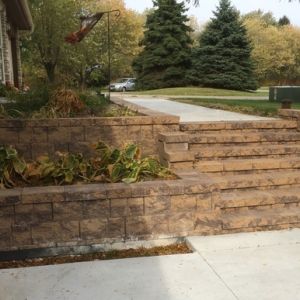 County Materials StoneWall Select block retaining wall and steps installed by Dresen Landscape Contractors in Somers, WI.