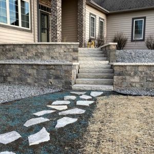 Unilock Estate Wall retaining walls (Sierra color), Ledgestone caps and steps installed in Waterford, WI.