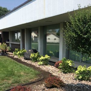 Design and installation of refreshed landscape beds including decorative stone and new nursery stock. Located in Racine.
