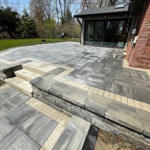 Raised paver patio installed to replace previous deck in Wind Point, WI.