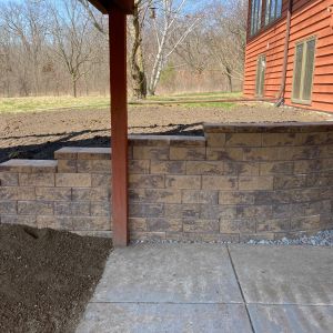 Under deck/walk out basement retaining wall installed using County Materials Tribute block (canyon brown color) in Somers, WI