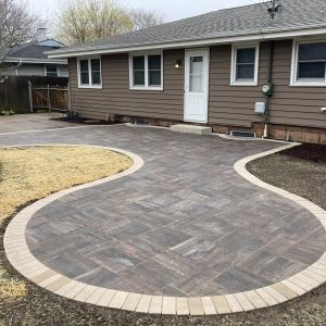 County Materials Grand Discover paver patio (timeless color) with vision colored border. Installed in Racine, WI.