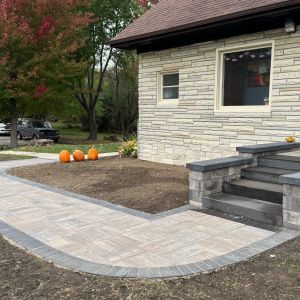 New stoop and walkway installed in Caledonia, WI. County Materials Passageways steps (reflection) with Tribute smooth block side-walls (timeless). 