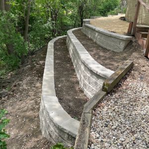 Three tiered retaining wall made of County Materials Integrity block. Installed in Mount Pleasant, WI.